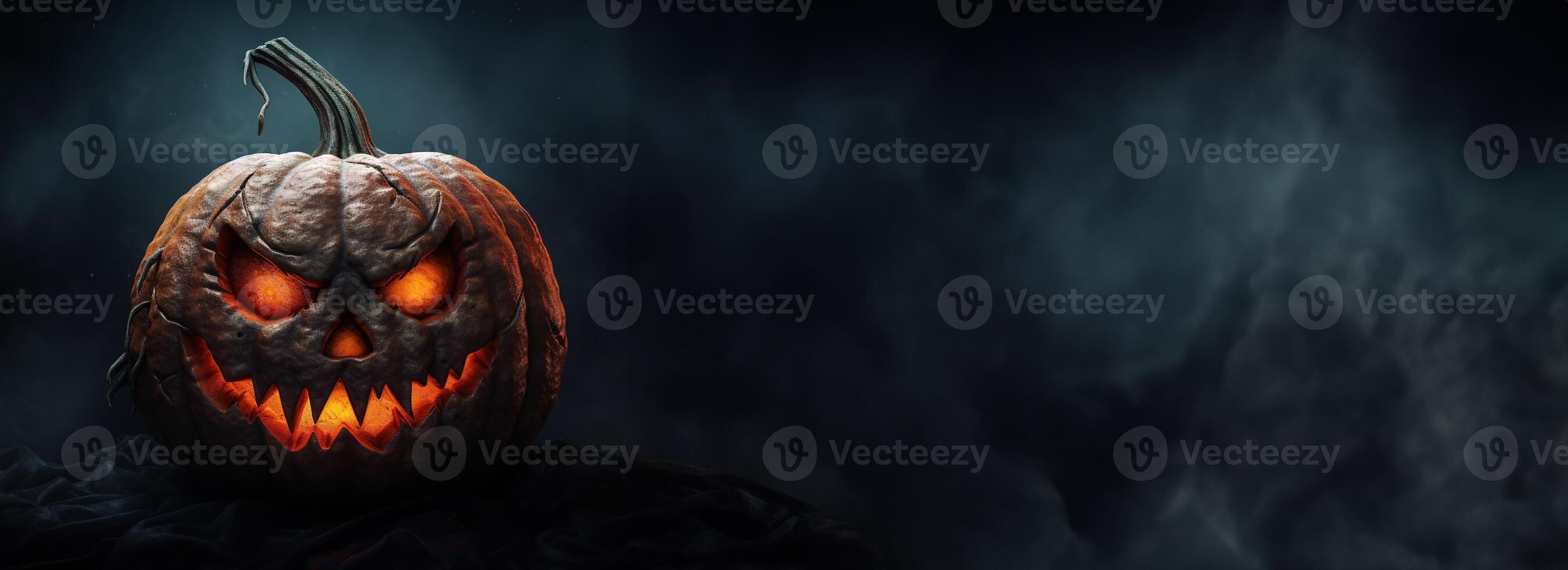 Halloween pumpkin head jack-o-lantern on dark background. photo