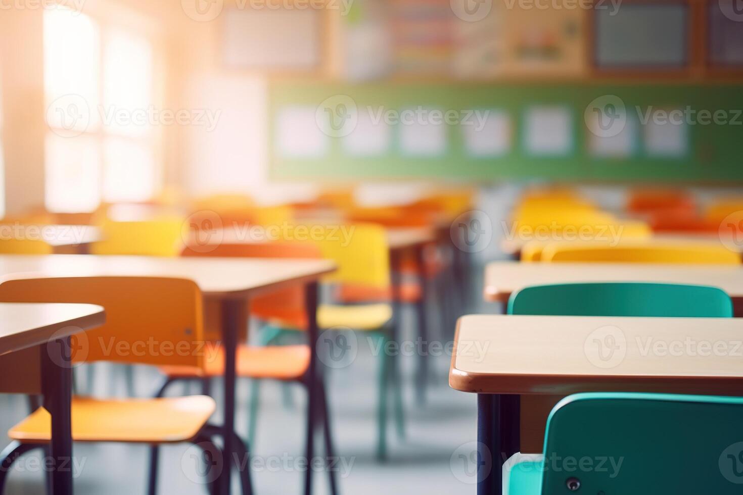 School classroom in blur background without young student. Blurry view of elementary class room no kid or teacher with chairs and tables in campus. Back to school concept. photo