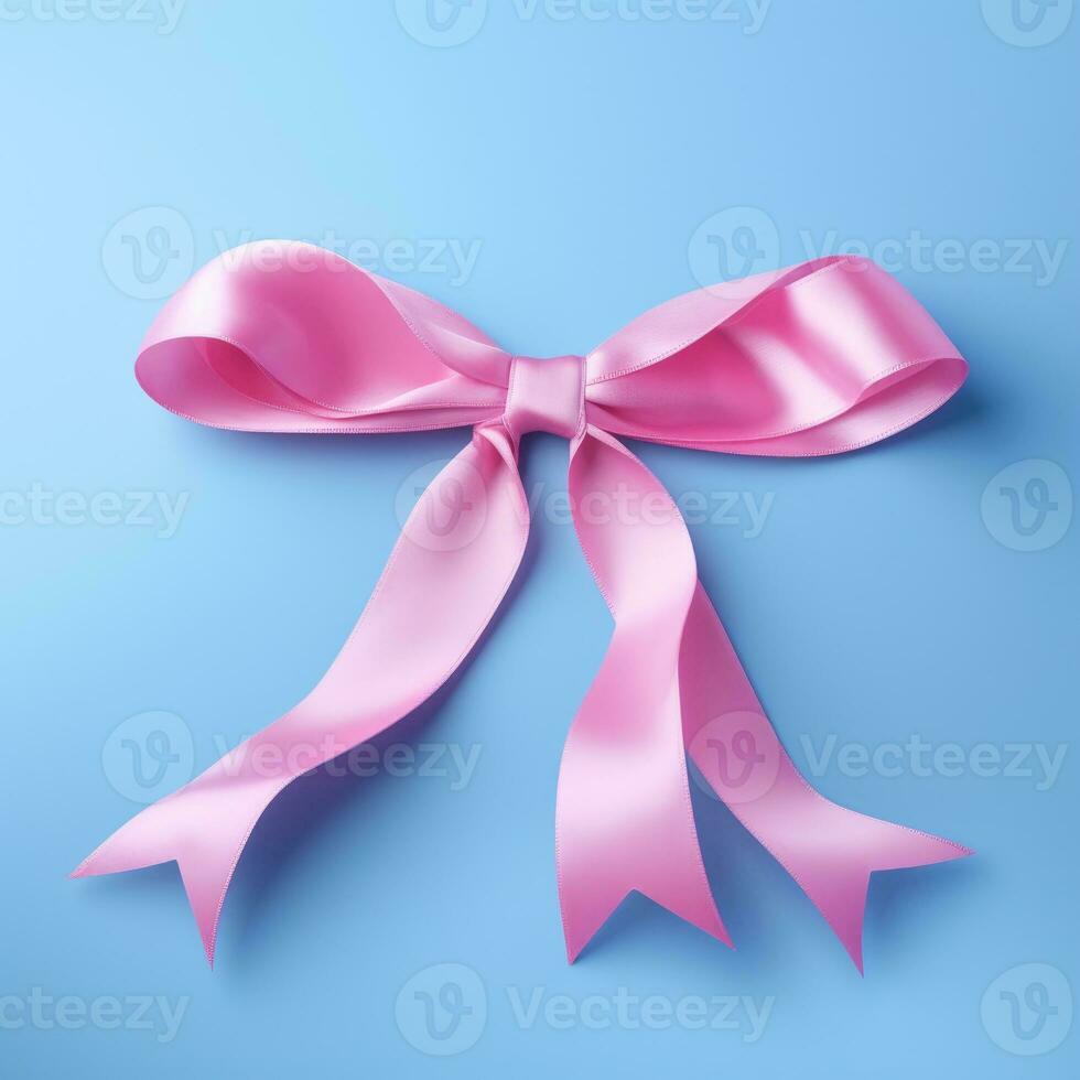 A pink ribbon on a blue background. Breast Cancer Month. photo