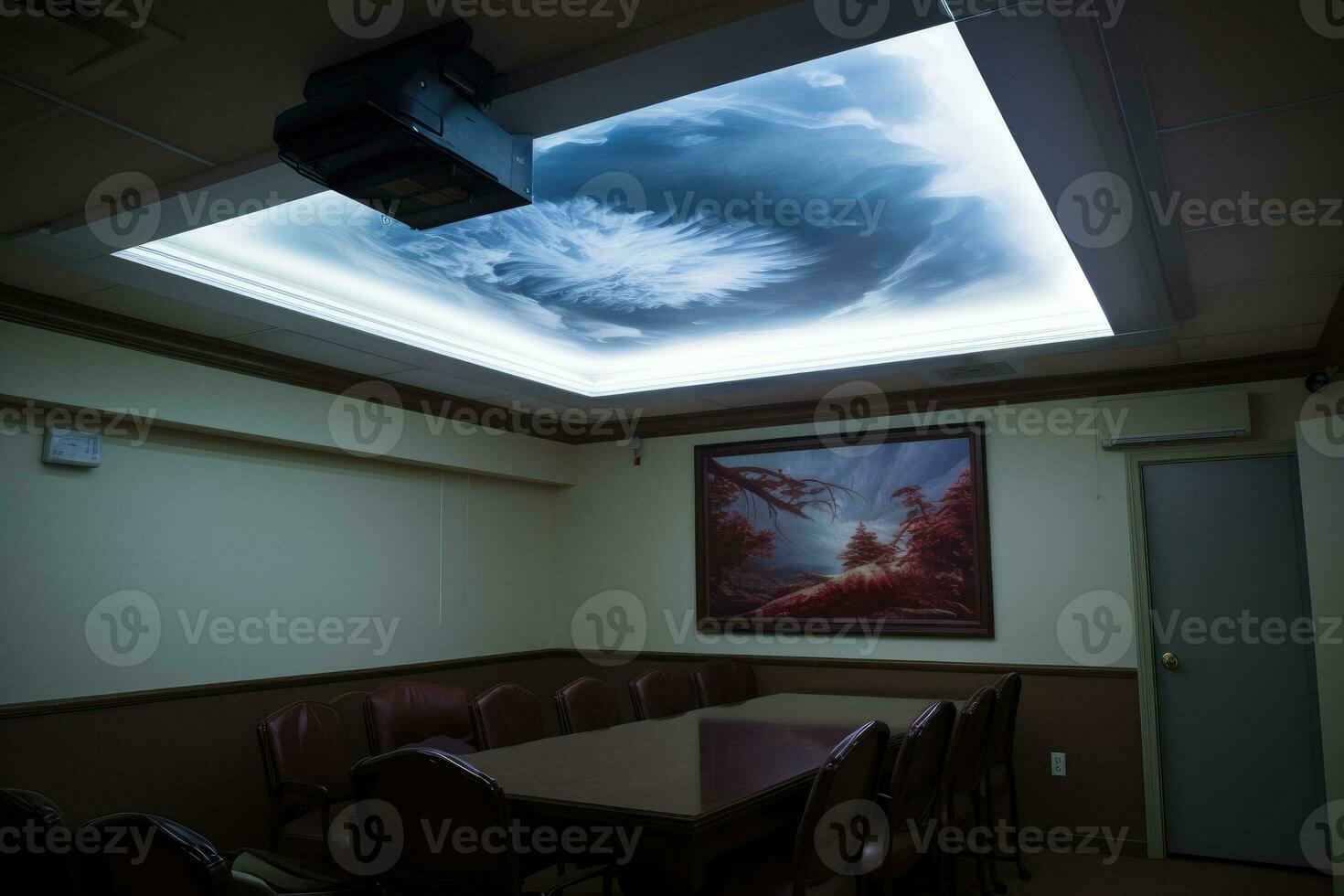 Overhead digital projector mounted on the ceiling of the boardroom. photo