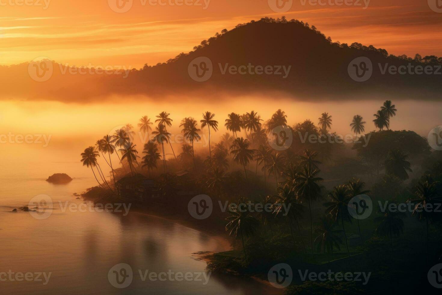 Tropical island at sunset, with warm orange and yellow hues painting the sky photo