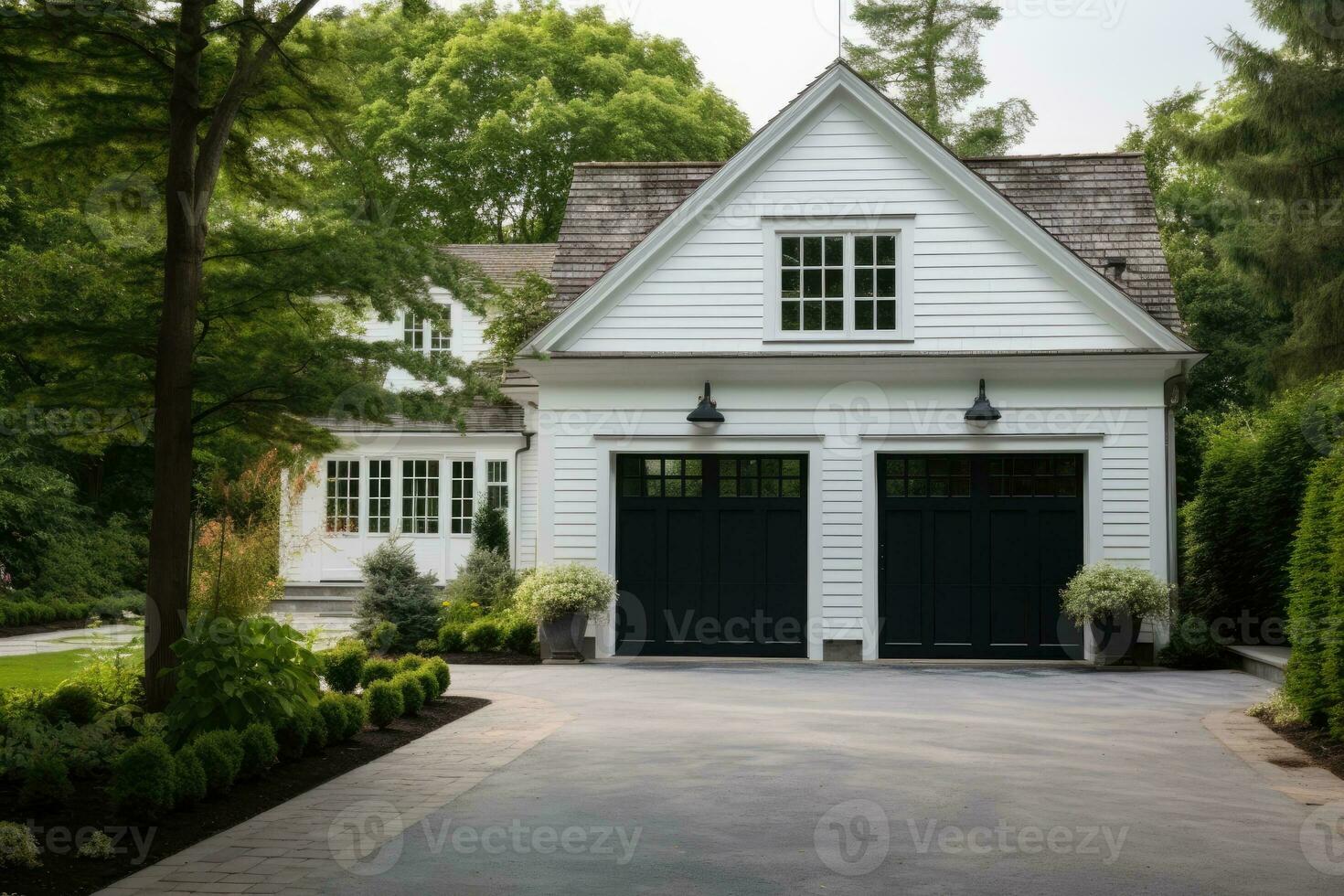 Garage door with a driveway in front. photo