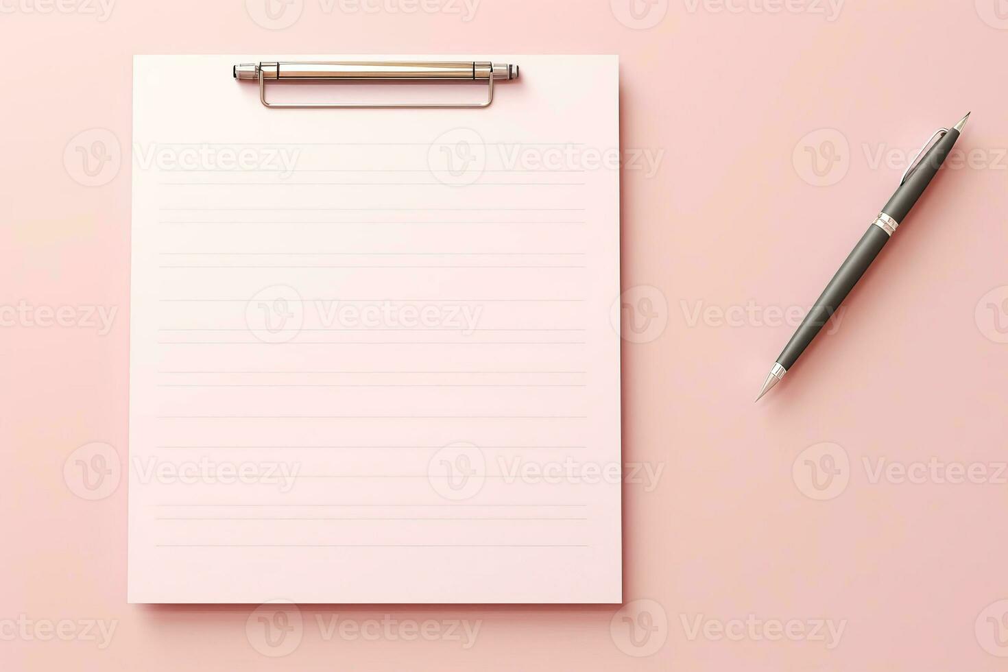 Clipboard blank note pages and pen on pink background. photo