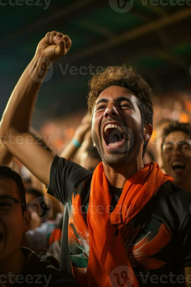 A group of passionate fans roar in excitement as the football season kicks off with a thrilling game photo