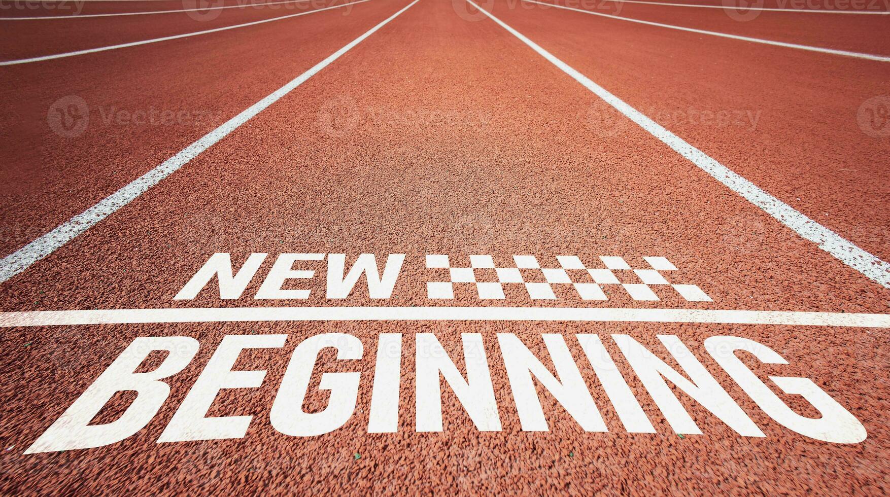 New beginning. Letters on red rubber running track. concept of inspiration for starting new ideas photo