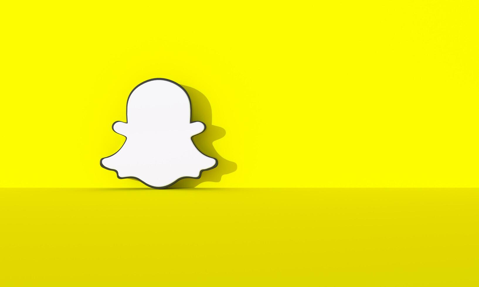 Madrid, Spain - August, 2023. social media logo on yellow wall background with hard shadow and space for text and graphics. photo