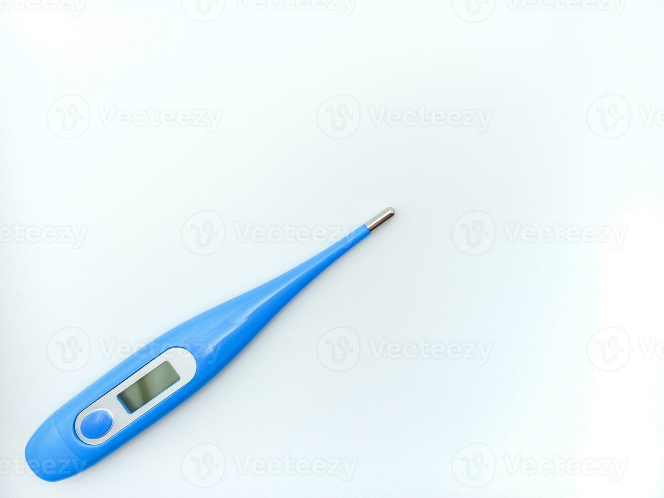 Blue Digital Thermometer Isolated On White Background. Tilted On Left Position With Negative Space photo