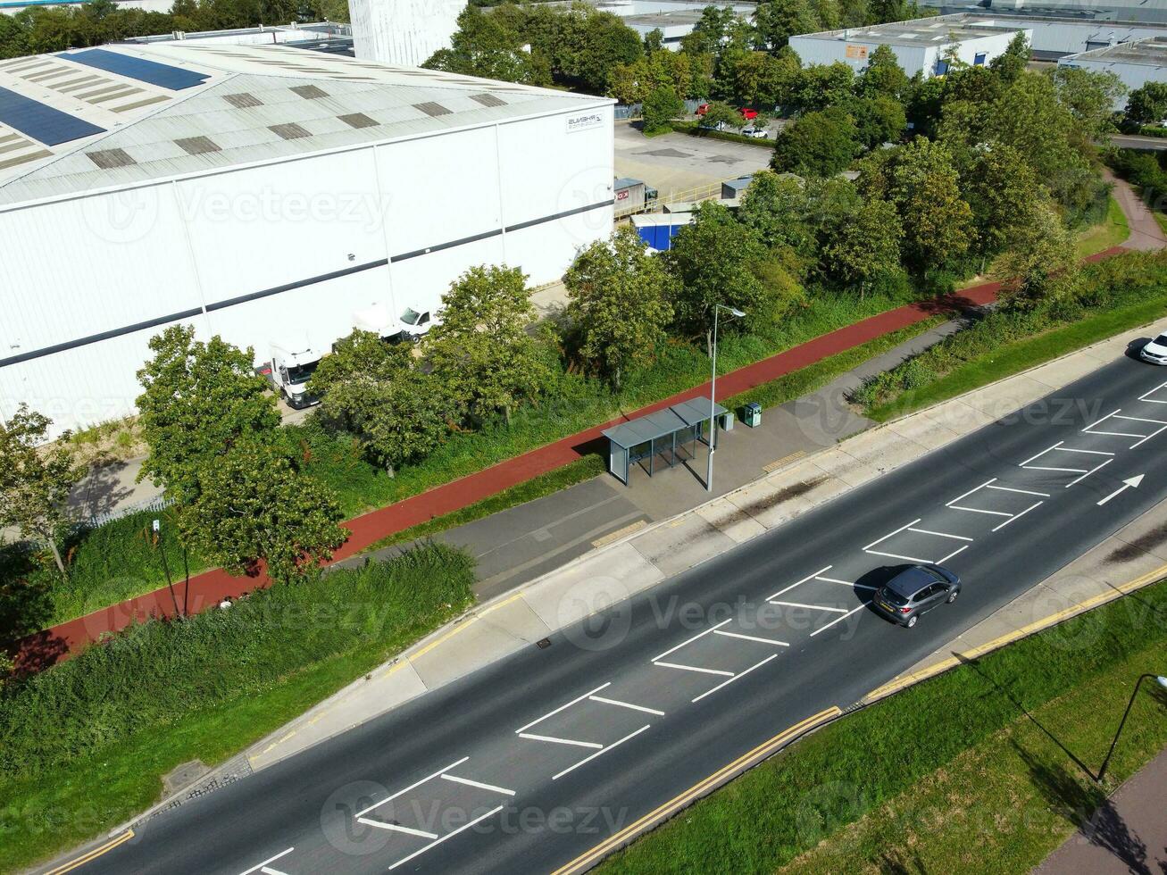 High Angle Footage of British Road and Traffic at Caldecotte Lake of Milton Keynes City of England Great Britain, Beautiful View Captured on August 21st, 2023 with Drone's Camera During Sunny Day photo