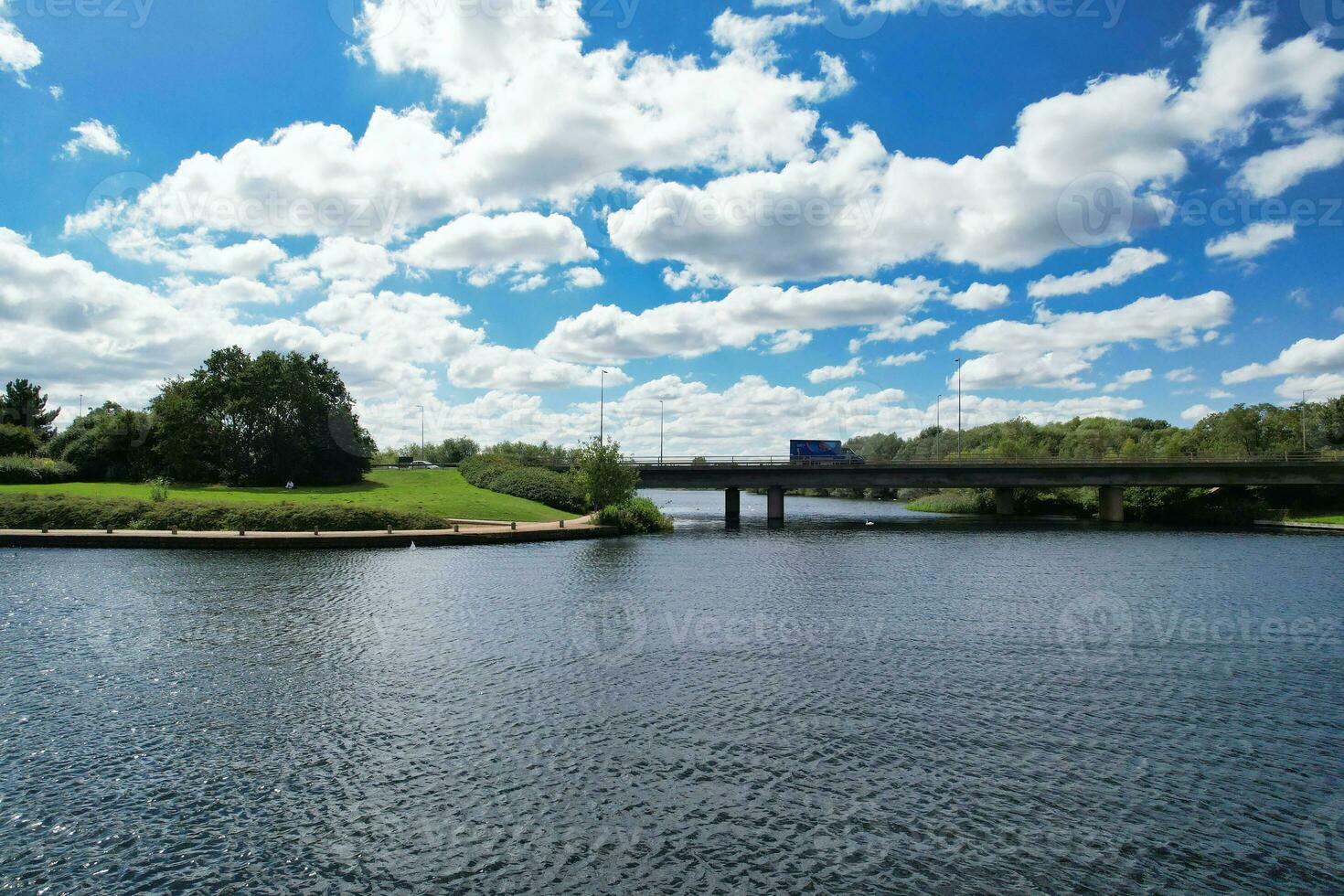 High Angle footage of People are Boating at Caldecotte Lake Located at Milton Keynes City of England Great Britain UK. The Aerial Landscape Was Captured on August 21st, 2023 with Drone's Camera photo
