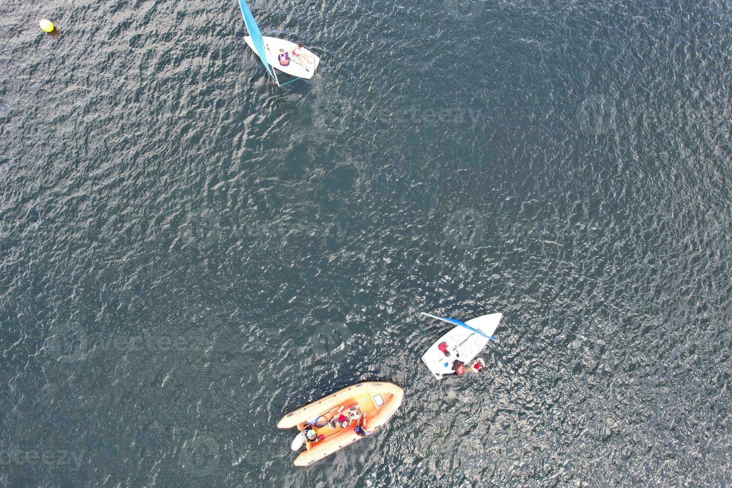 High Angle footage of People are Boating at Caldecotte Lake Located at Milton Keynes City of England Great Britain UK. The Aerial Landscape Was Captured on August 21st, 2023 with Drone's Camera photo