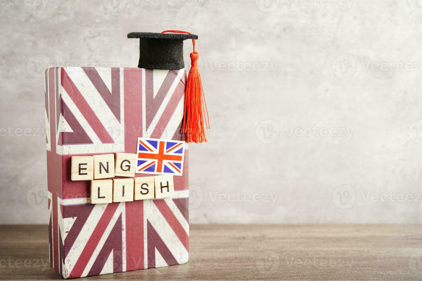 English book with graduate hat, learning and tutorial for foreigner. photo