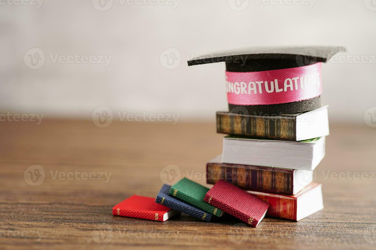 Graduation hat on book with copy space, learning university education concept. photo