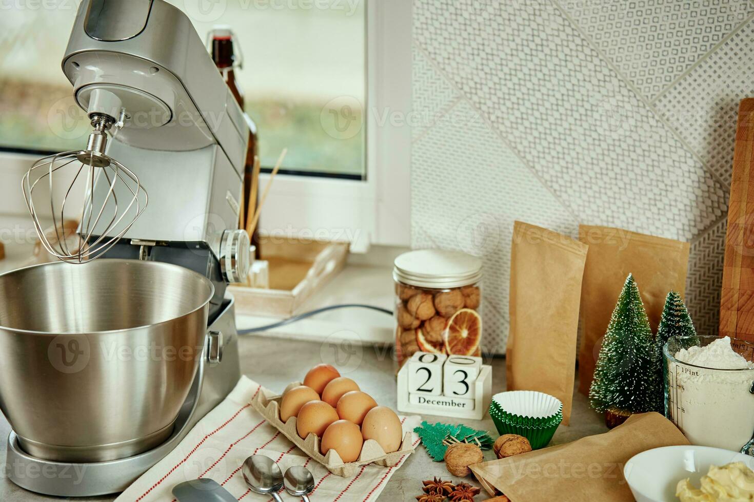 Kitchen interior with food ingredients and electric mixer photo