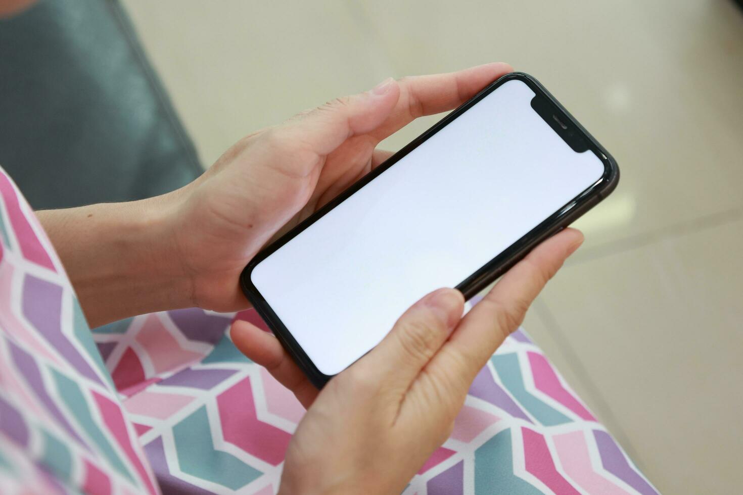 Hand holding phone white screen, mobile phone white screen photo