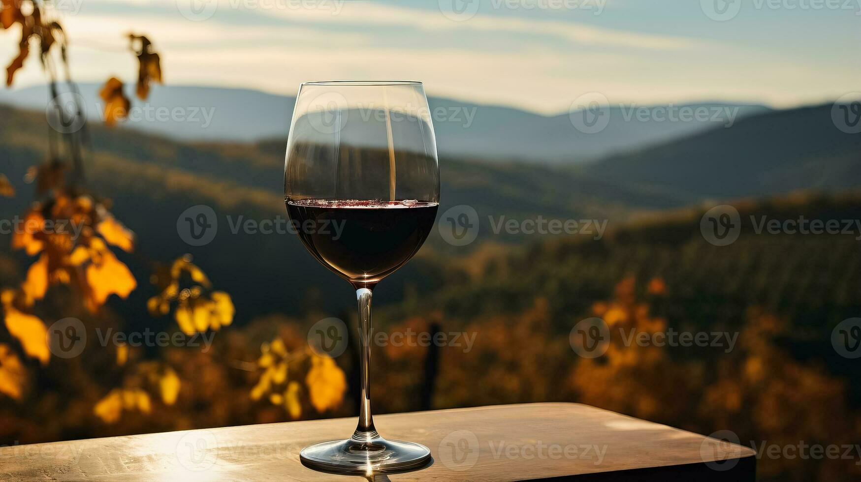 un vaso de profundo rojo vino vertido en contra un fondo de vistoso otoño viñedos atractivo usted a complacer en un saboreo experiencia foto