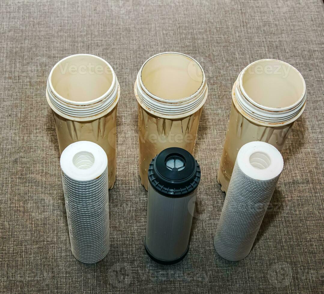 Clean water filters are ready for installation. The process of replacing the cartridges of a multi-stage water filter. photo