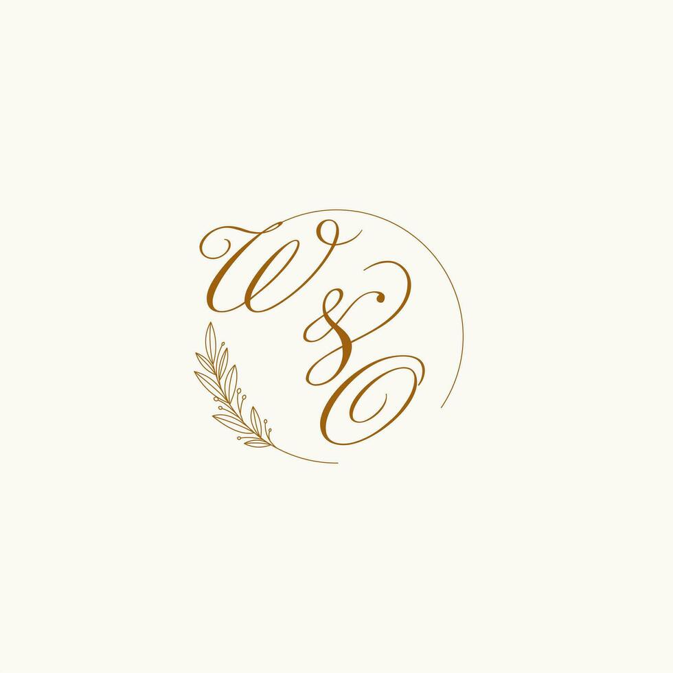 Initials WO wedding monogram logo with leaves and elegant circular lines vector