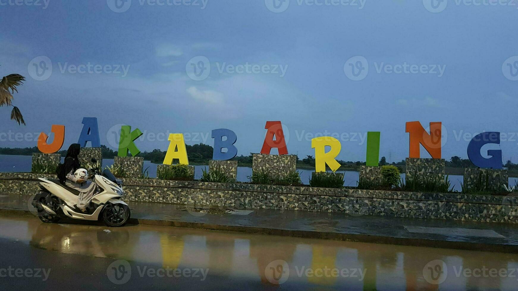 Scooter on the river in Jakabaring, Palembang One of the capital and larger city of Indonesia. photo