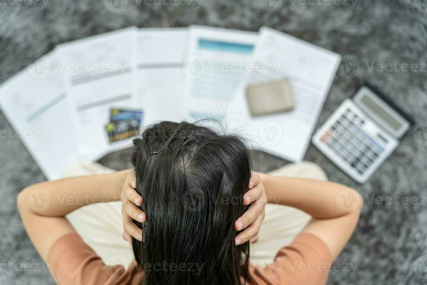 Stressed and headache woman with large bills or invoices no money to pay to expenses and credit card debt. shortage, Financial problem, bankruptcy, mortgage, loan, bankrupt, poor, empty wallet photo