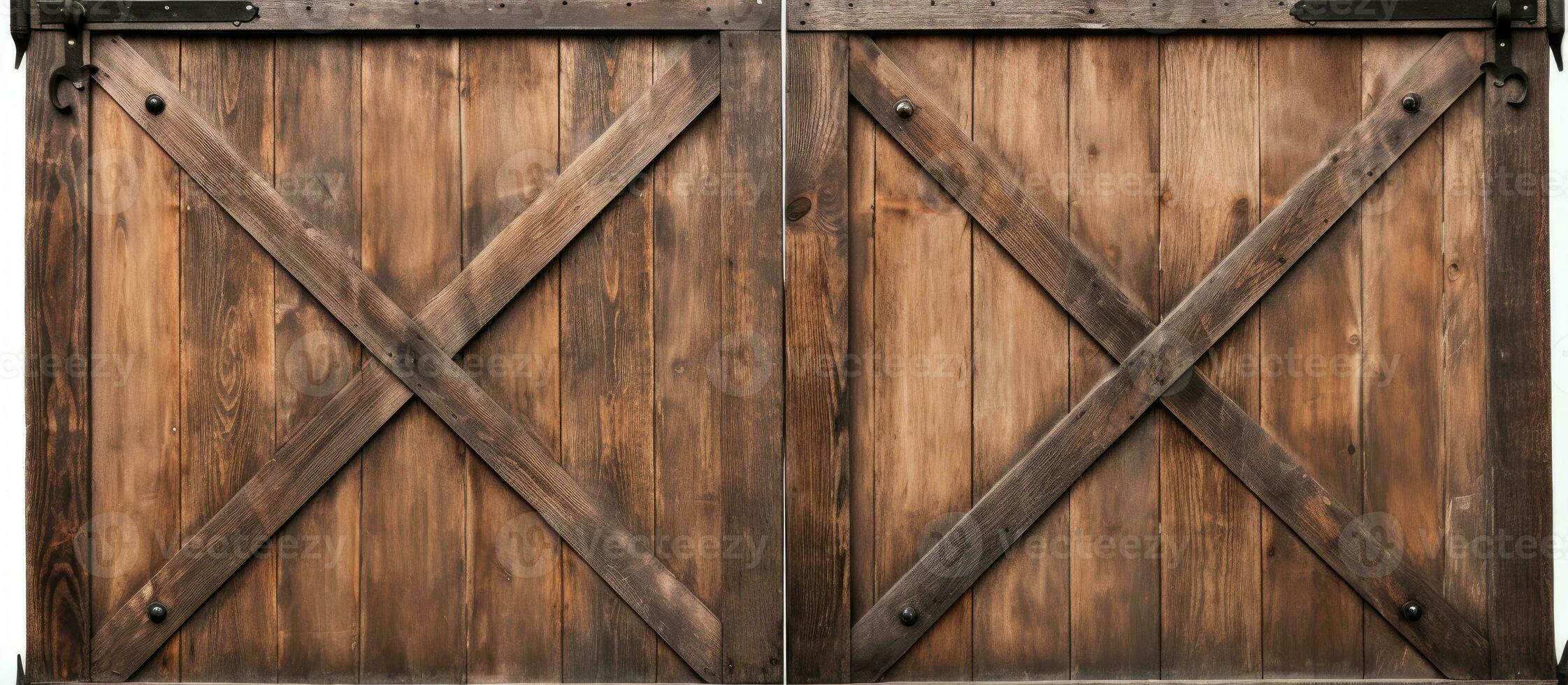 Closeup of a vintage double barn door with wooden texture and metallic handle and bolts seen from the front photo