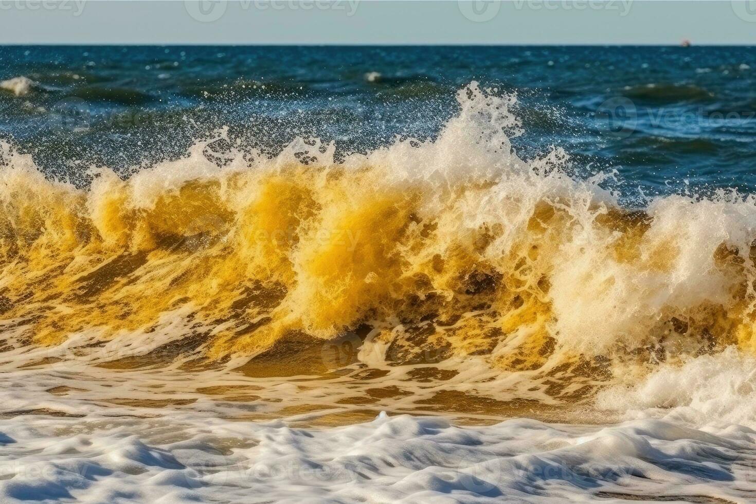 powerful ocean wave breaking onto the shore photo