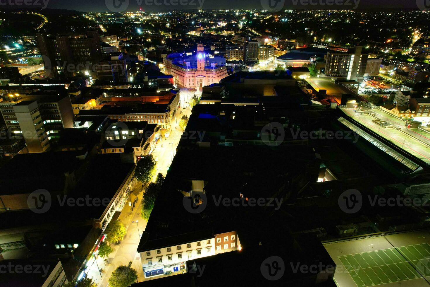 Aerial View of Illuminated Downtown Buildings, Roads and Central Luton City of England UK at Beginning of Clear Weather Night of September 5th, 2023 photo