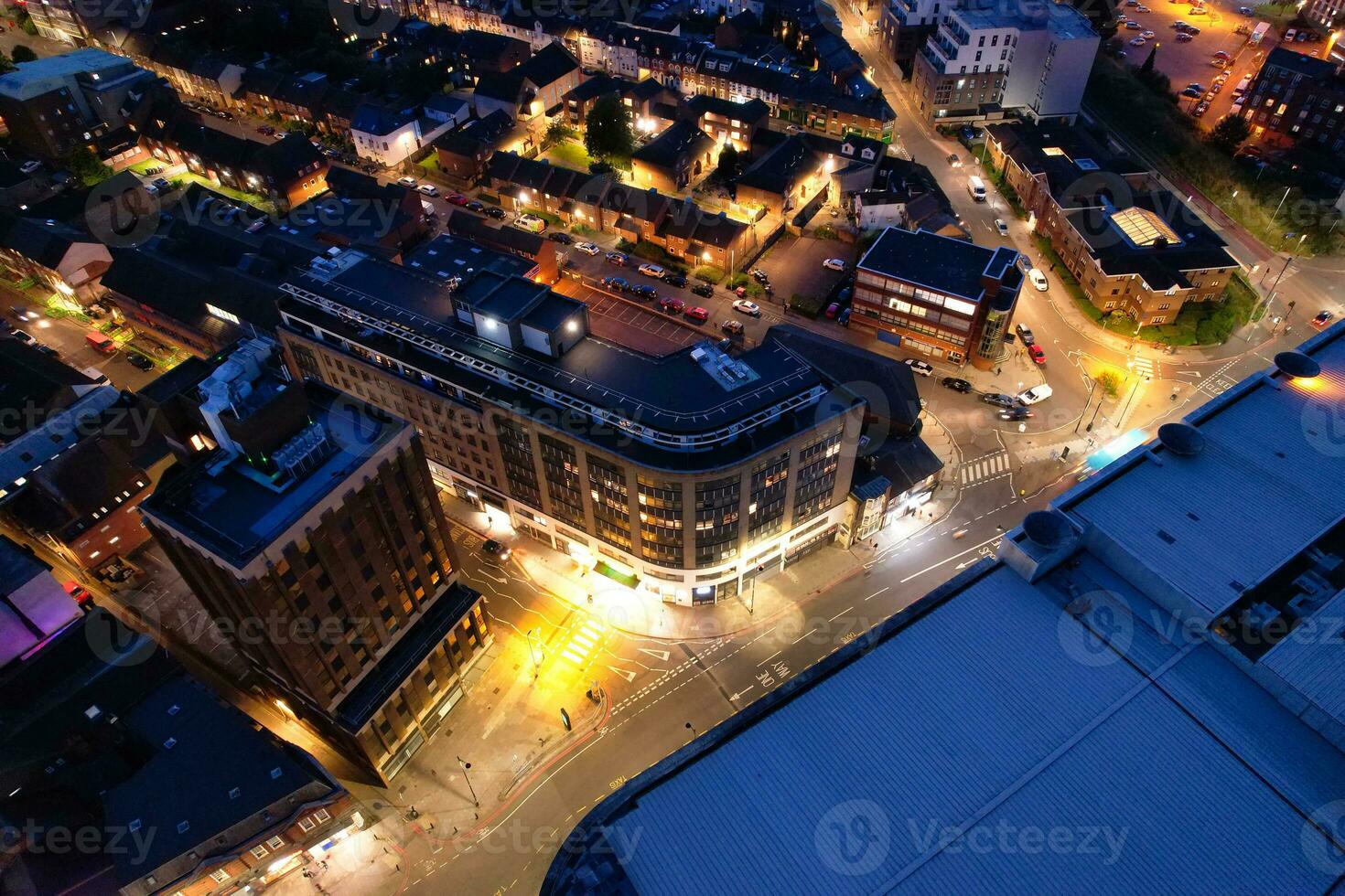 Aerial View of Illuminated Downtown Buildings, Roads and Central Luton City of England UK at Beginning of Clear Weather Night of September 5th, 2023 photo