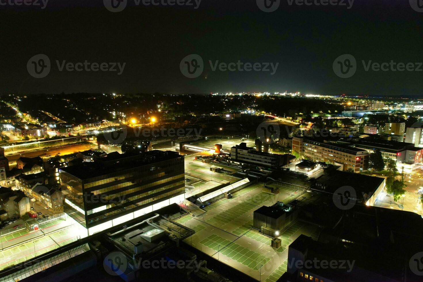 Aerial View of Illuminated Downtown Buildings, Roads and Central Luton City of England UK at Beginning of Clear Weather Night of September 5th, 2023 photo