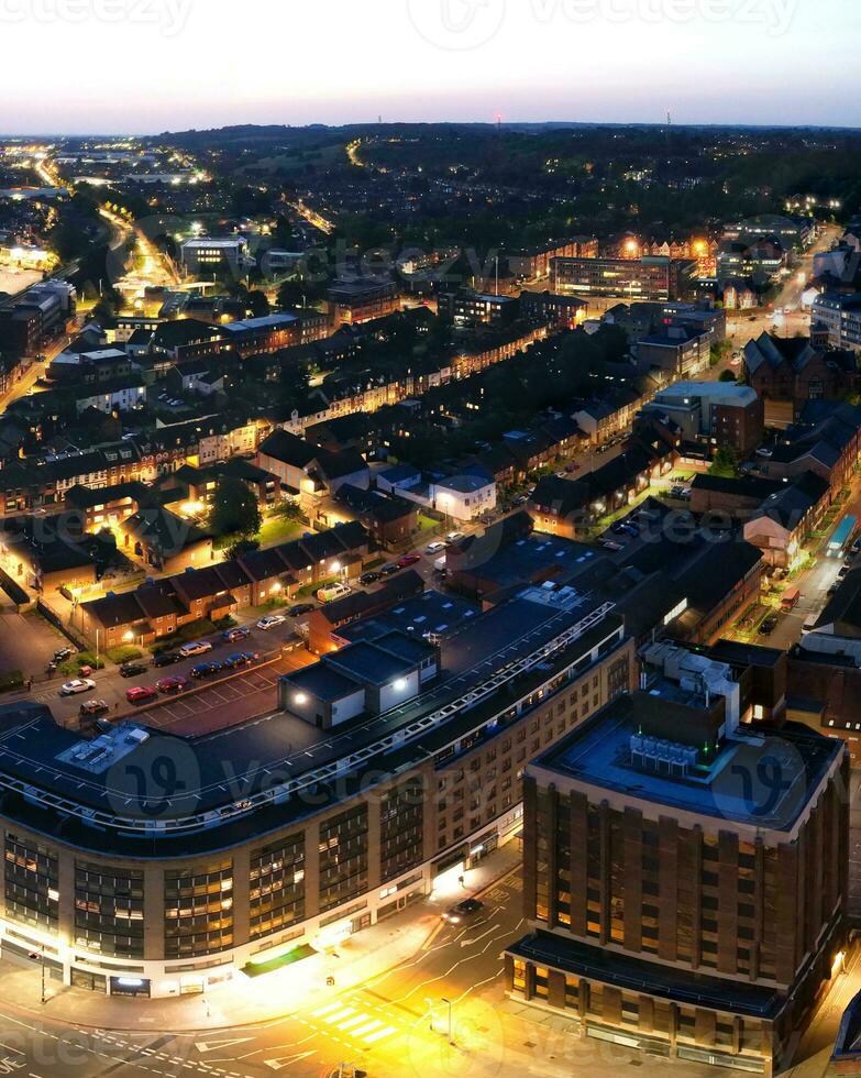 Aerial Vertical Panoramic View of Illuminated Downtown Buildings, Roads and Central Luton City of England UK at Beginning of Clear Weather's Night of September 5th, 2023 photo