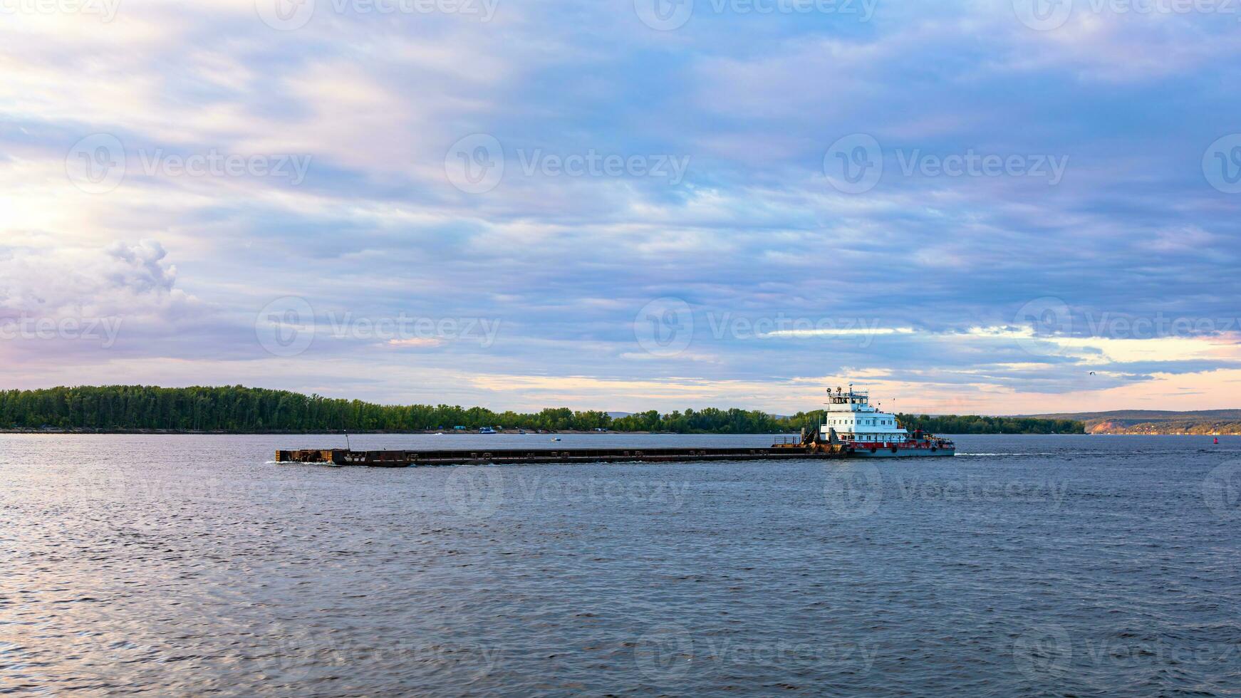 Barge on the large river photo