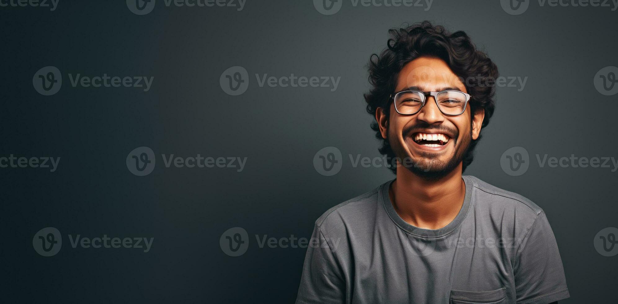 A happy young Indian man in glasses with copy space. AI Generated photo