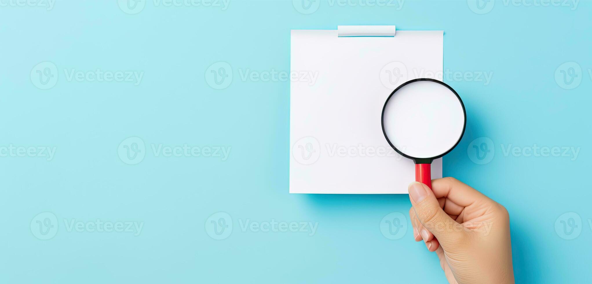 a hand holding a magnifying glass over a blank white paper. AI Generated photo