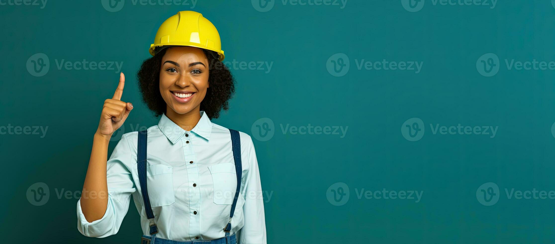 smiling african american female construction worker in yellow helmet pointing up with copy space. AI Generated photo