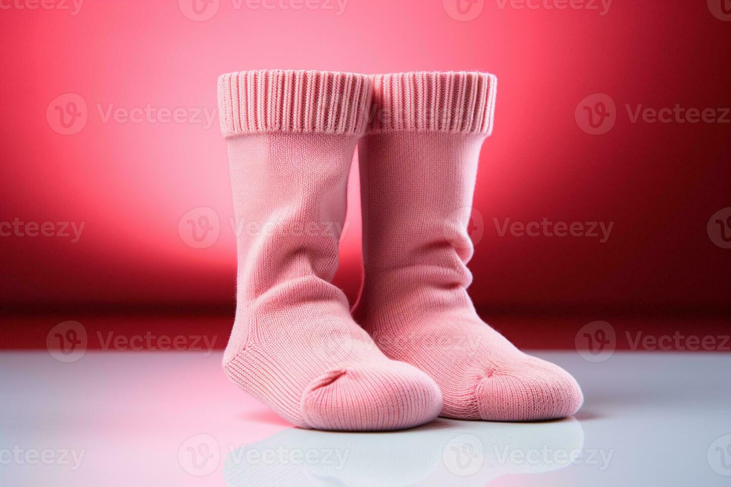Delicate baby socks on pink surface provide copy space for charming newborn greetings AI Generated photo
