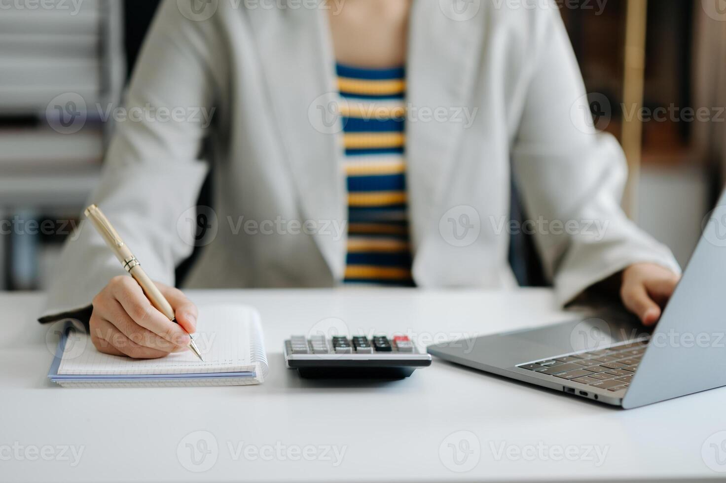 businesswoman hand working with new modern computer and writing on the notepad strategy diagram as concept photo