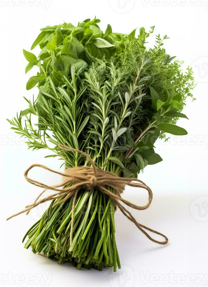 A bundle of fresh herbs - rosemary thyme and sage - ready to be used in tasty Thanksgiving recipes on a white background photo