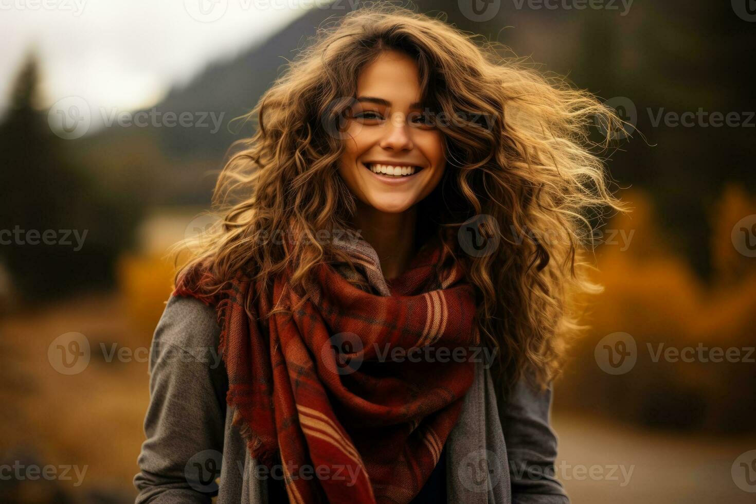 A cozy plaid scarf wrapped around a smiling model capturing the warmth and style of fall fashion photo