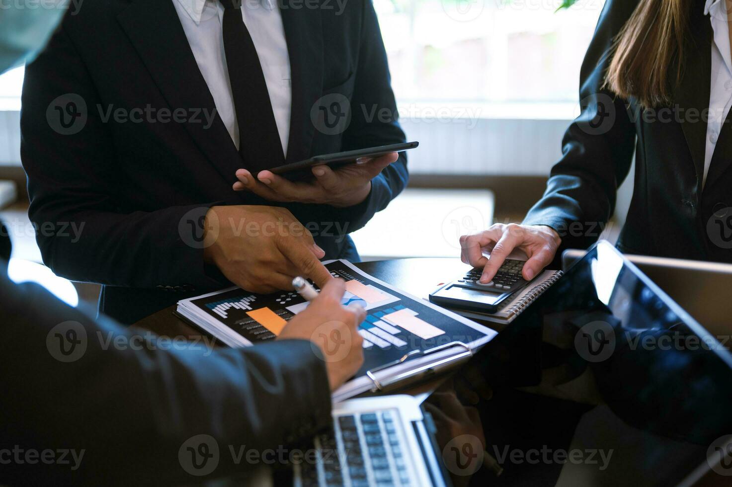 Business team meeting present.professional investor working with  Finance managers task. with laptop smart phone and digital tablet in morning light photo