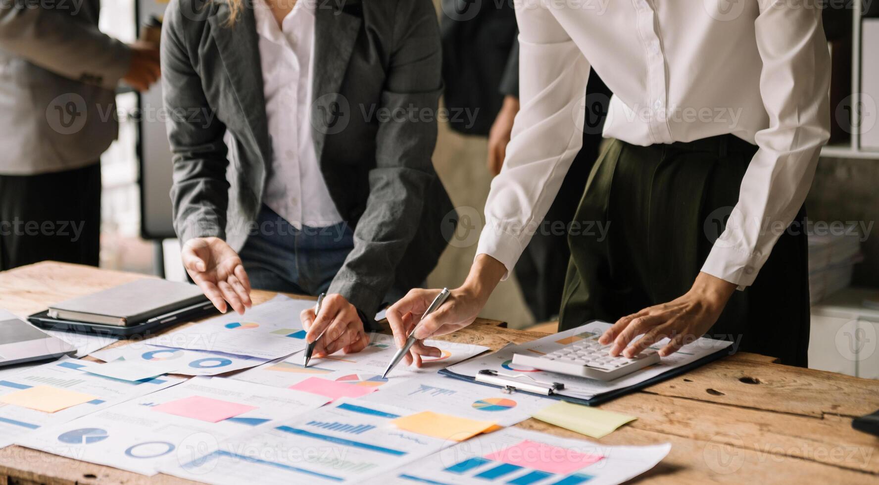 Business team meeting. professional investor working new start up project. Finance task. with smart phone and laptop and digital tablet computer  in morning light photo