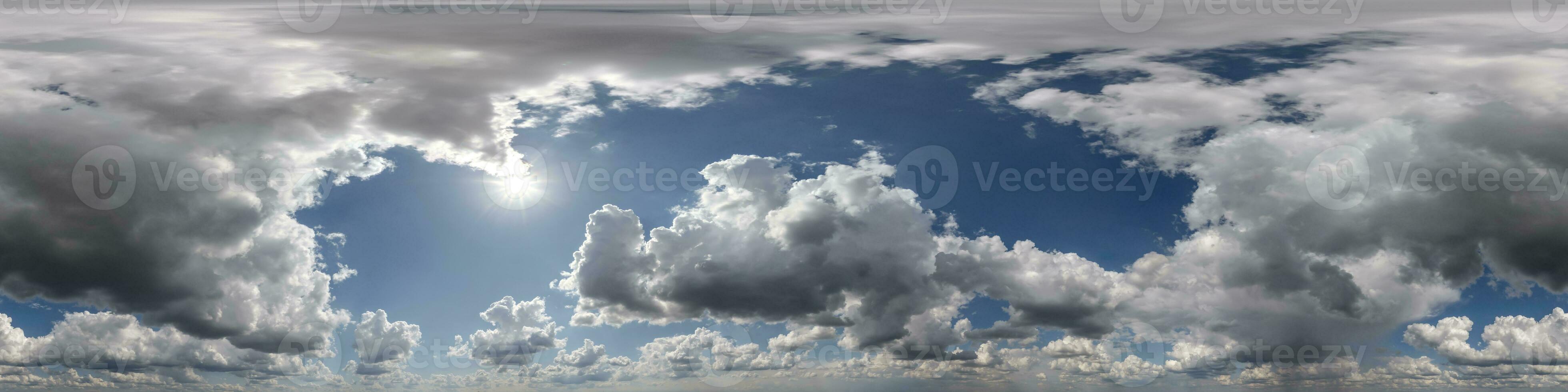 360 hdri panorama of blue overcast skydome with cumulus clouds, seamless sky panorama view with zenith for use in 3d graphics or game development or edit drone shot photo