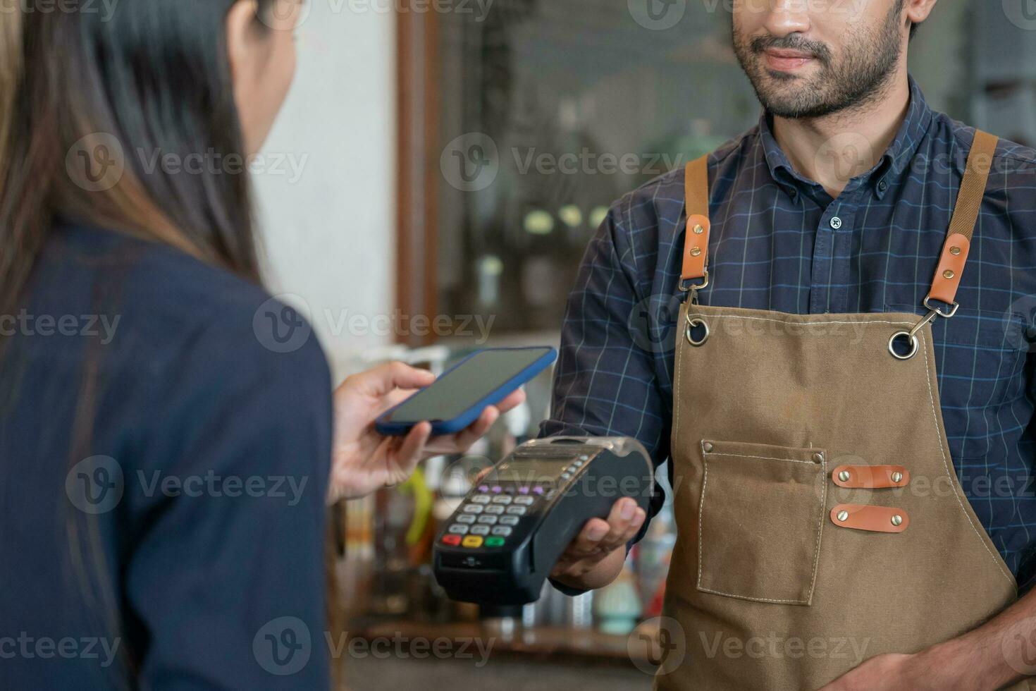 Woman use smartphone to scan QR code for order menu in cafe restaurant with a digital delivery. Choose menu and order accumulate discount. E wallet, technology, pay online, credit card, bank app. photo