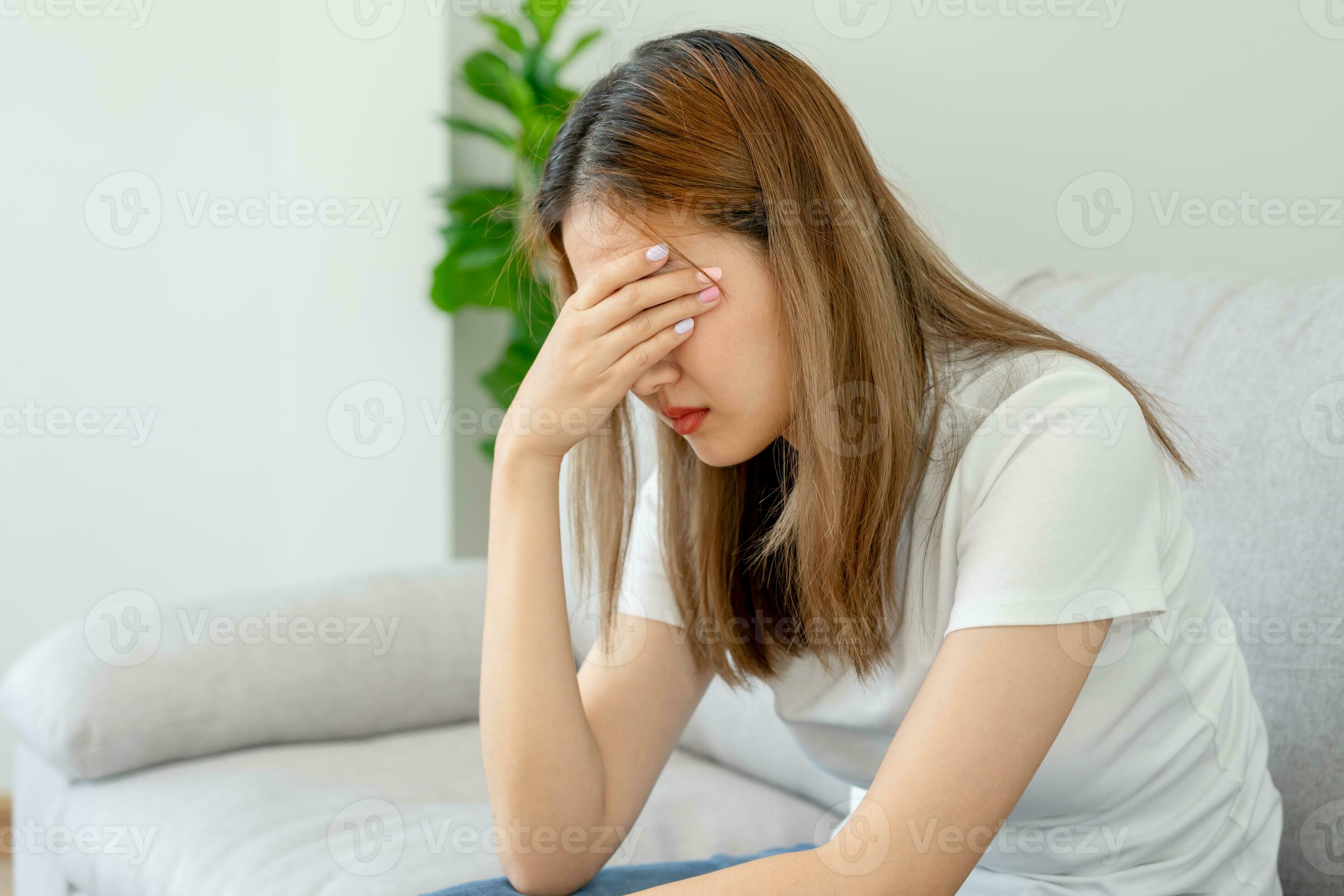 Unhappy asian woman girl disappointed sad about problem in home alone Unhappy asian woman girl disappointed sad about problem in home alone