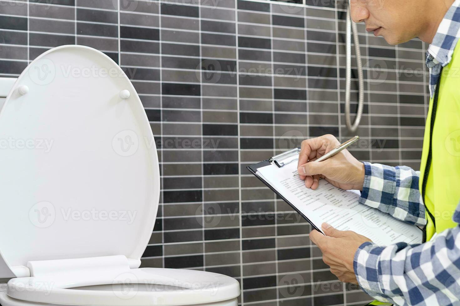 inspector or engineer is inspecting construction and quality assurance new house using a checklist. Engineers or architects or contactor work to build the house before handing it over to the homeowner photo