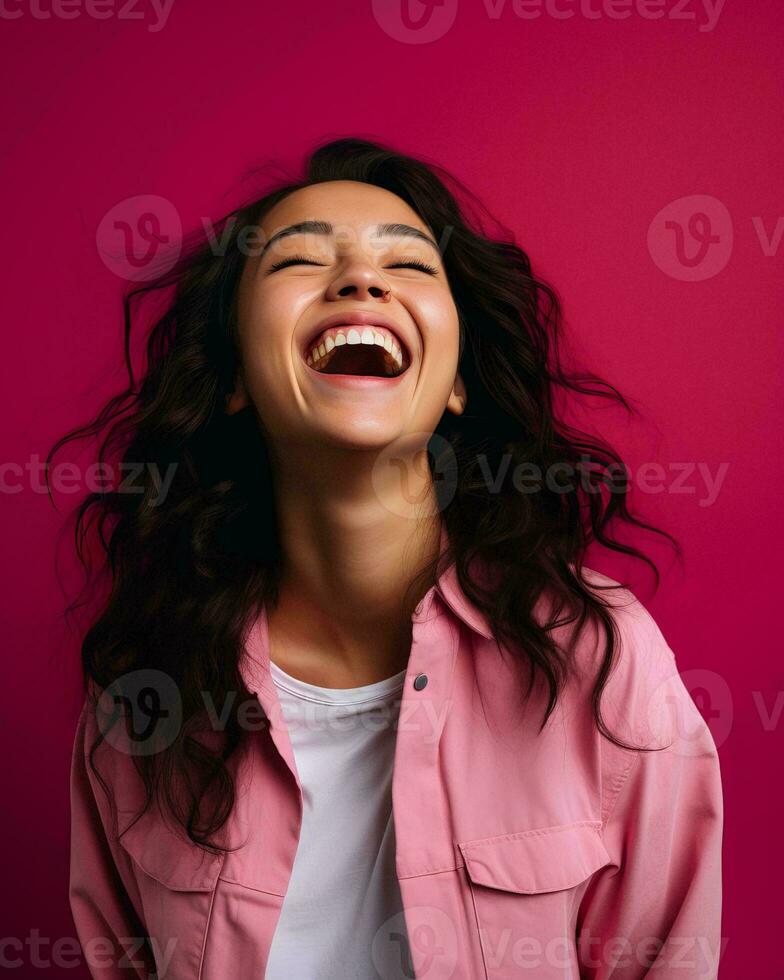 portrait of happy asian woman laughing on pink background stock photo generative AI