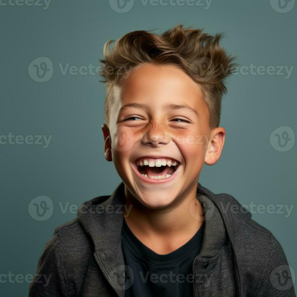 a young boy is laughing and smiling in front of a gray background generative ai photo