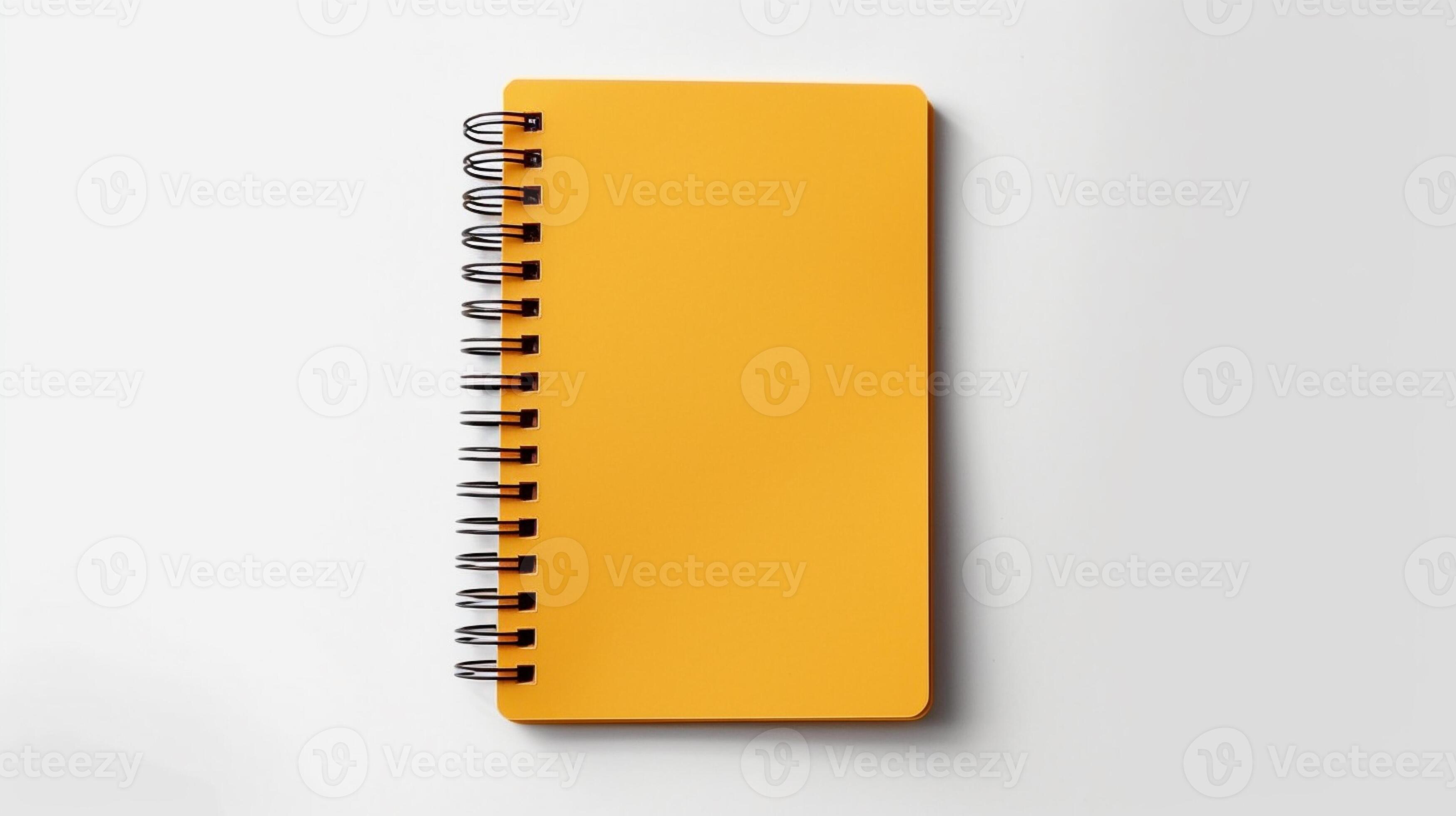 yellow spiral notebook with spiral binding on white background