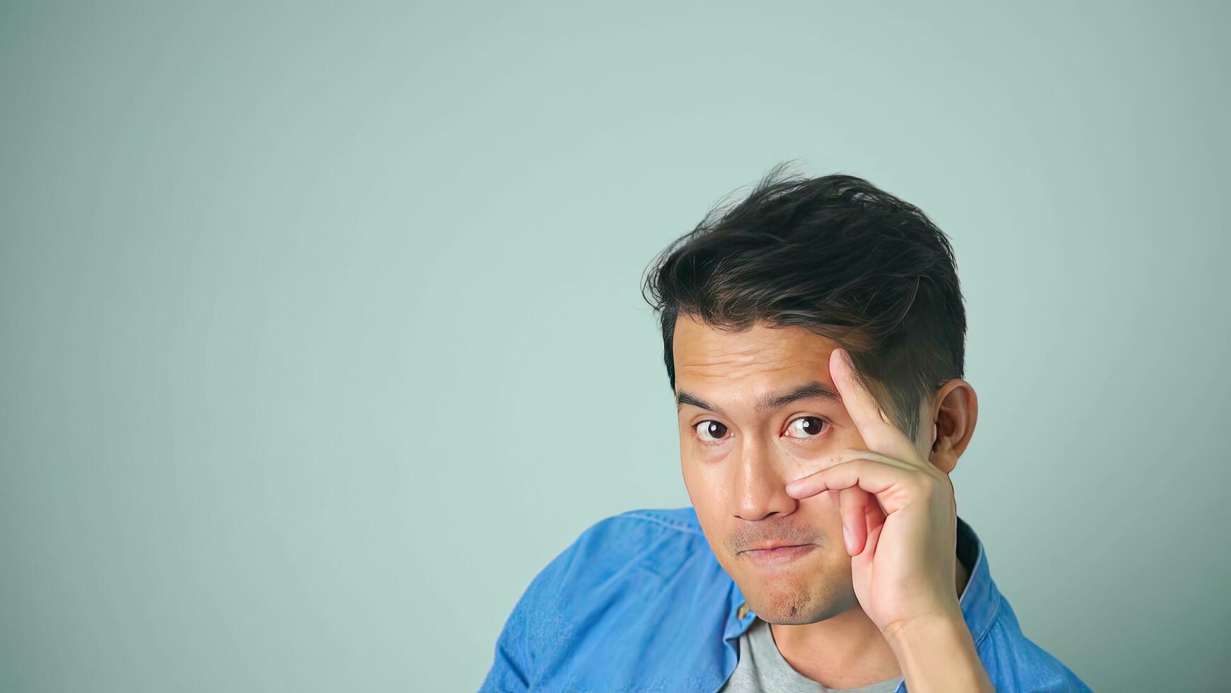 Asian man happy laughing standing on white background. photo