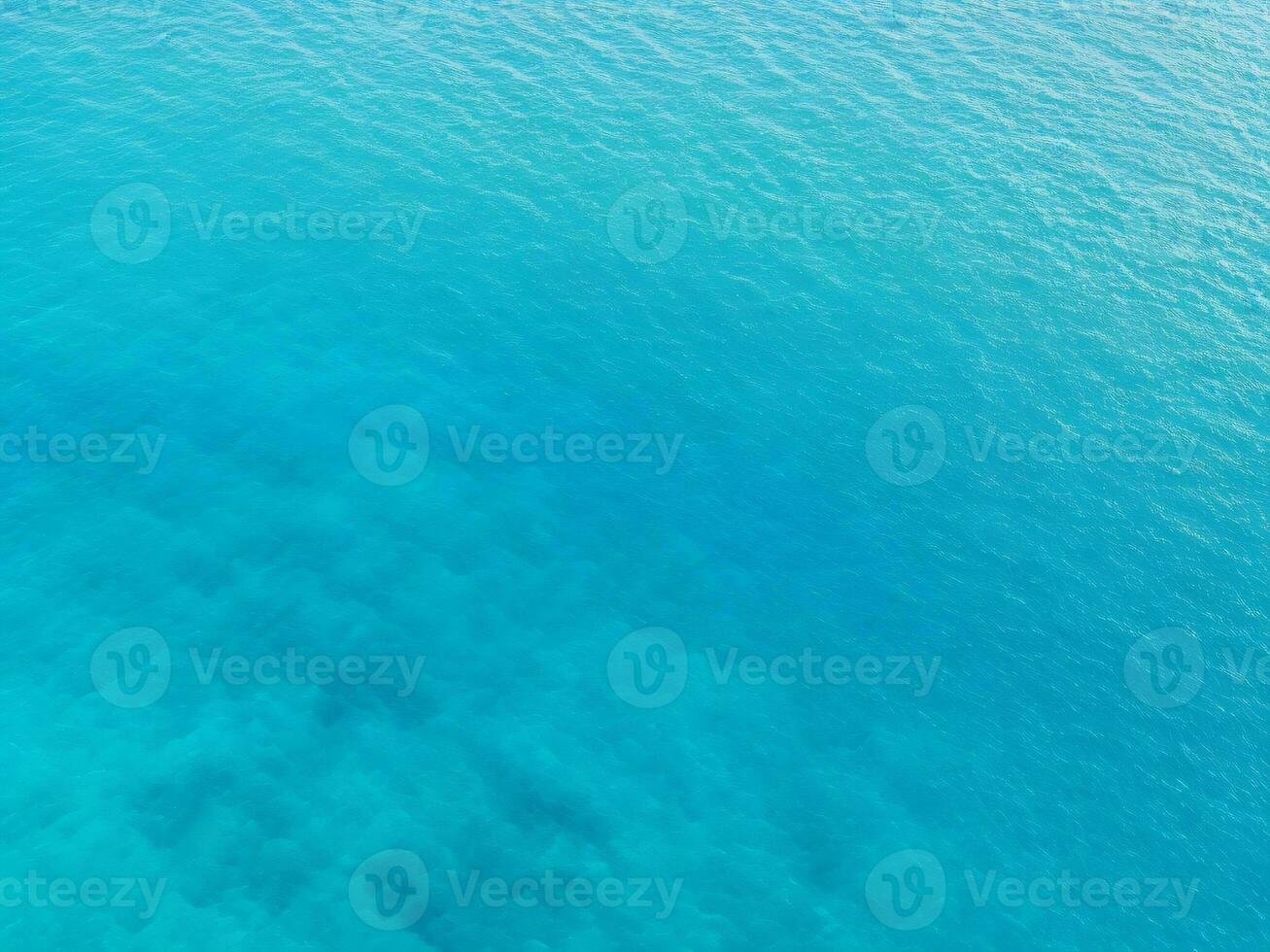 Top view of blue frothy sea surface, Shot in the open sea from above photo