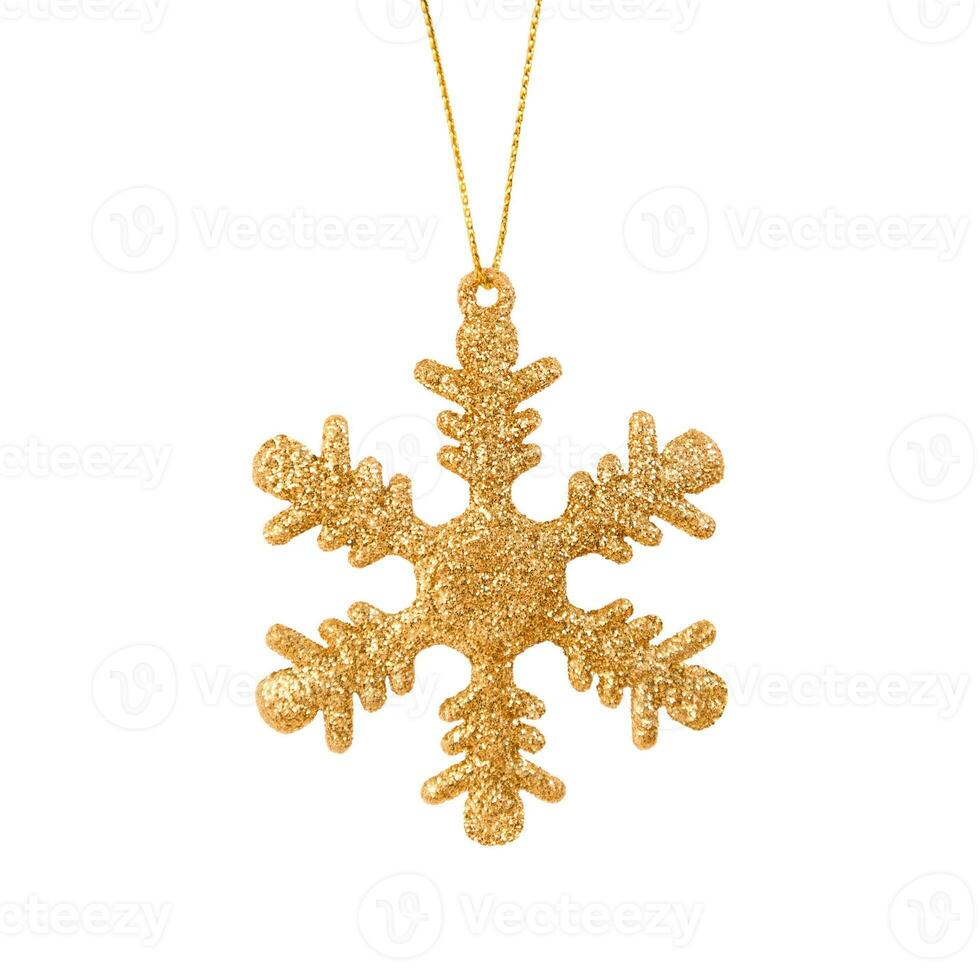 Hanging golden snowflake Christmas tree ornament isolated on a white background. Stock photo