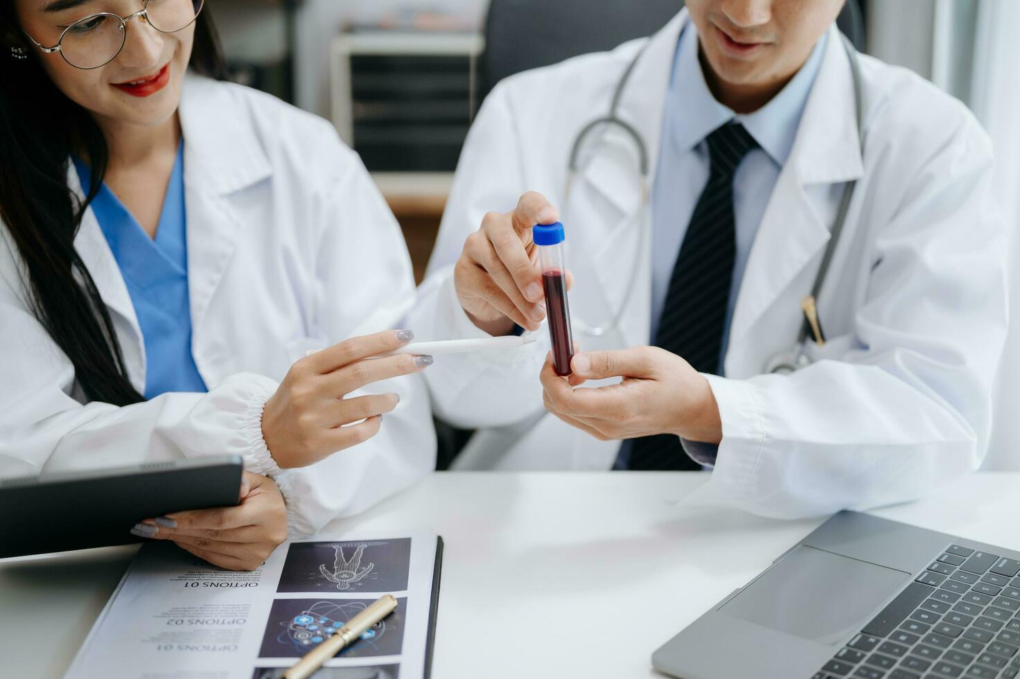 Medical technology network team meeting concept. Doctor hand working with smart phone modern digital tablet and laptop computer with graphics chart interface, with virtual icon diagram photo